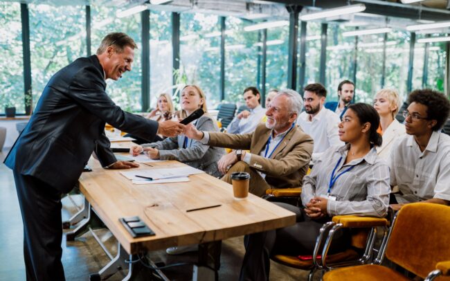 Cinematic image of a conference meeting.