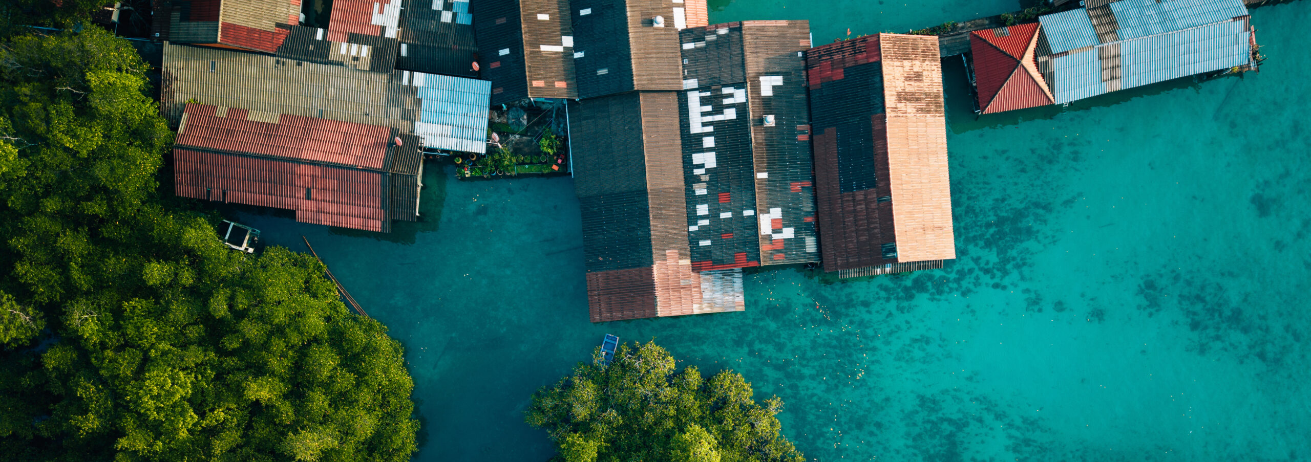 Aerial view of a traditional coastal village living in harmony w aerial view of a tropical fishing village over tur 2026 09 25 03 54 13 utc cr scaled