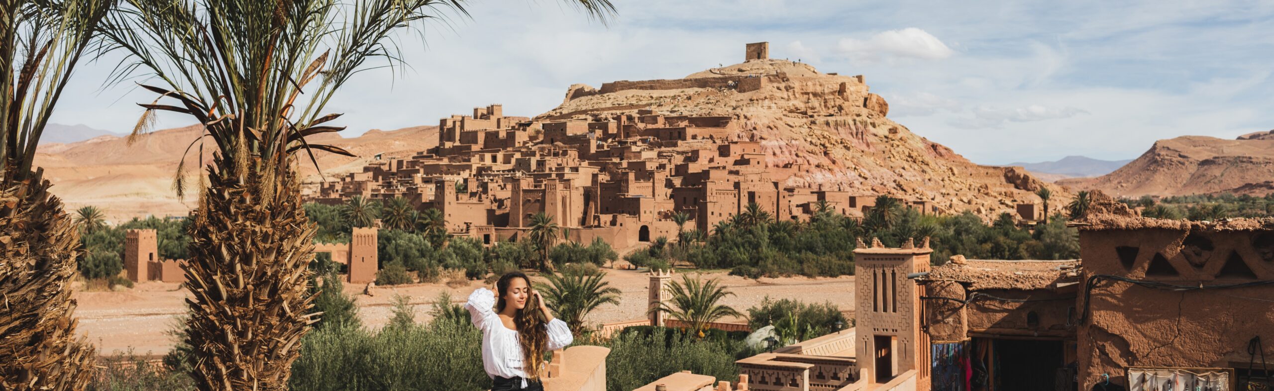 Beautiful young woman happy to travel in Morocco. Ait-Ben-Haddou Travel in Morocco. Ait-Ben-Haddou