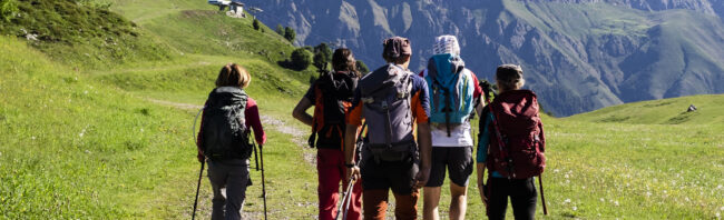 Group of hikers walking in the mountains, Orobie Mountains, Lecco, Italy Orobie Mountains, Lecco, Italy