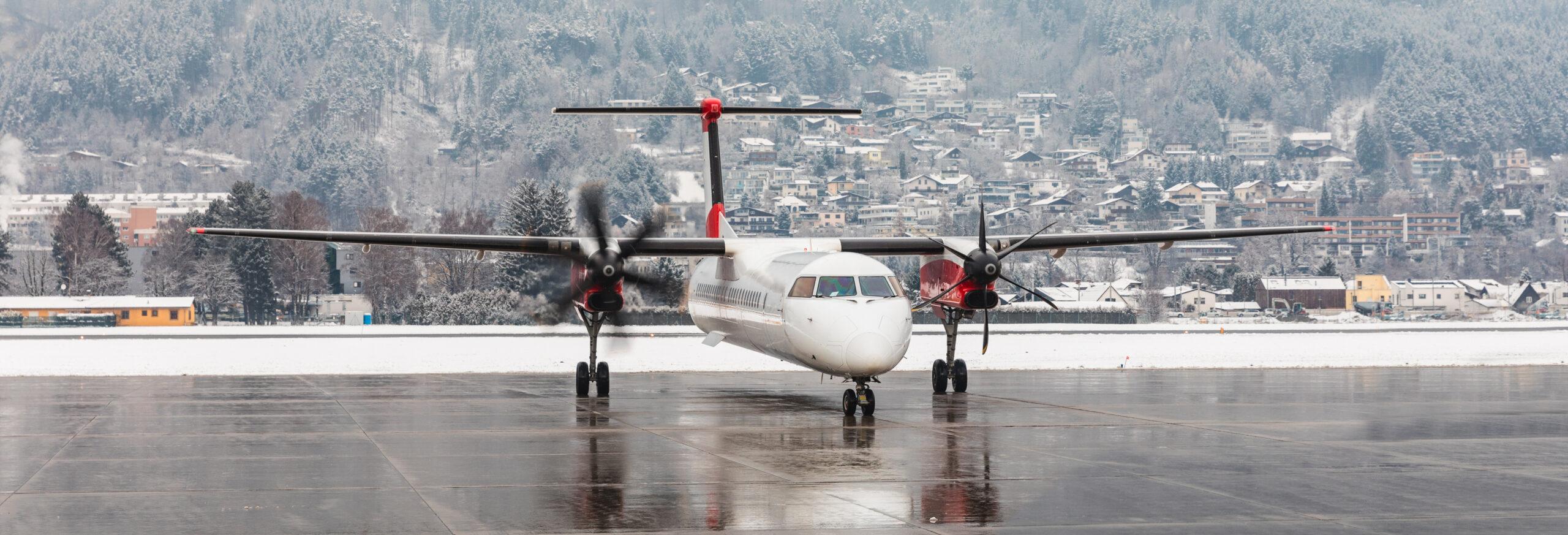 Aeroplane starting engines with a snowy winter background