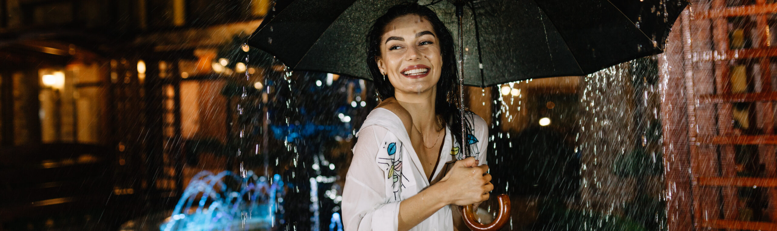 Laughing woman with umbrella checking for rain 一位面带微笑的女子撑着伞站在雨中 2026 09 23 23 58 05 UTC cr scaled