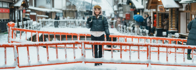 Woman tourist Visiting Ginzan Onsen in Yamagata, happy Traveler Woman tourist Visiting Ginzan Onsen in Yamagata